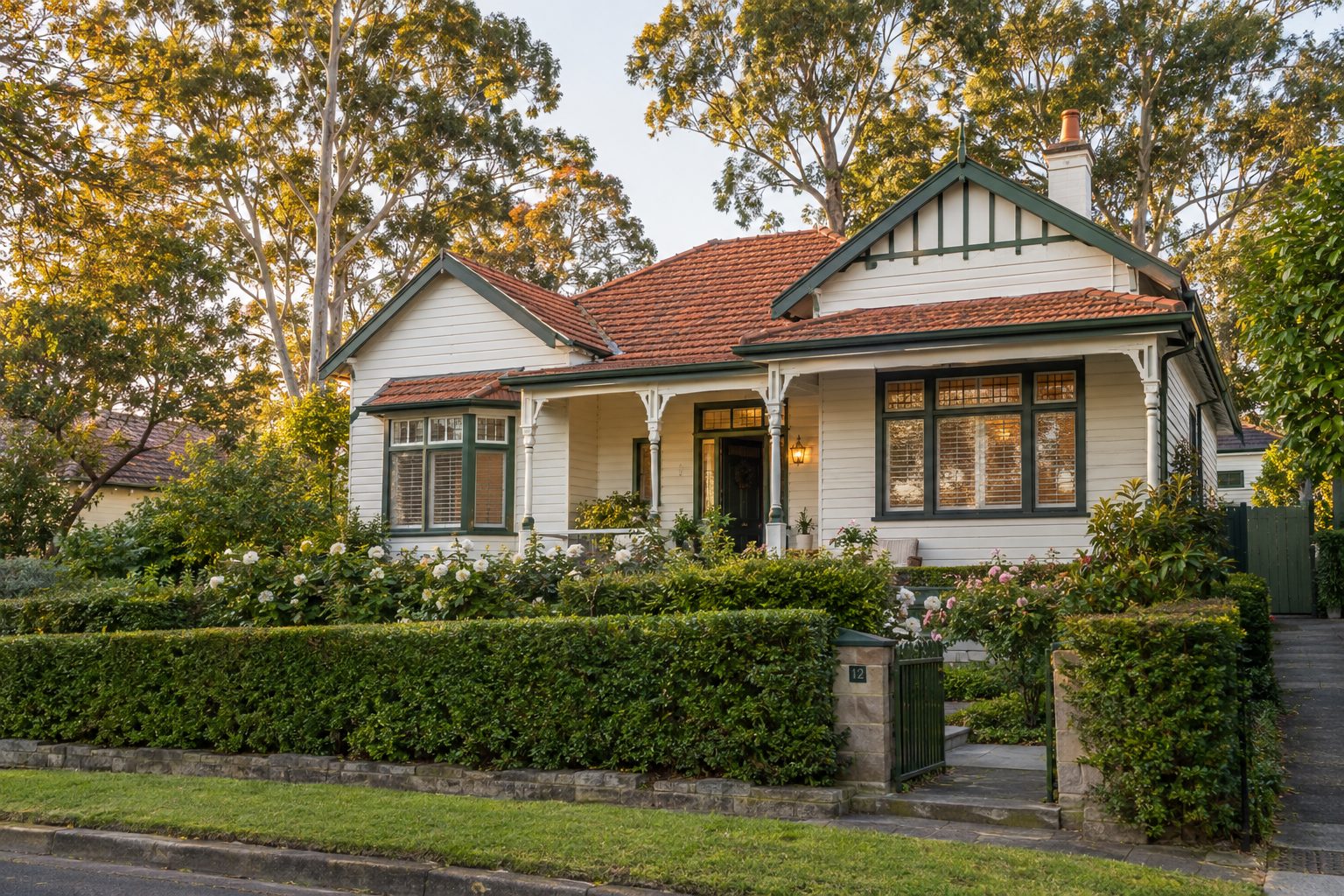Federation weatherboard home in Wahroonga with freshly painted white boards and deep green trims